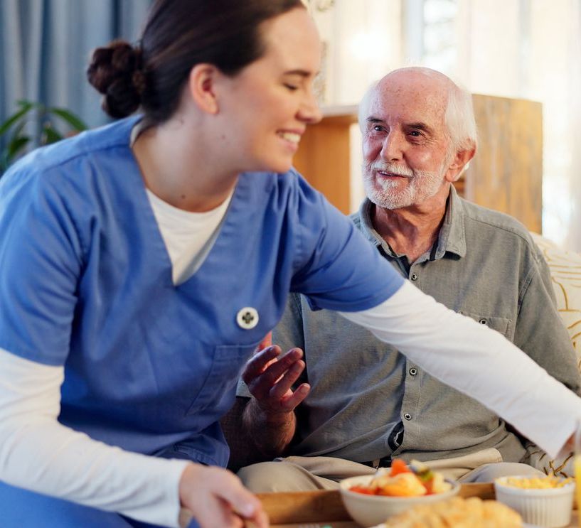Breakfast, nurse and senior man in nursing home for elderly care, nutrition and support. Retired male person, caregiver and service for hungry patient in assisted living, healthcare and wellness